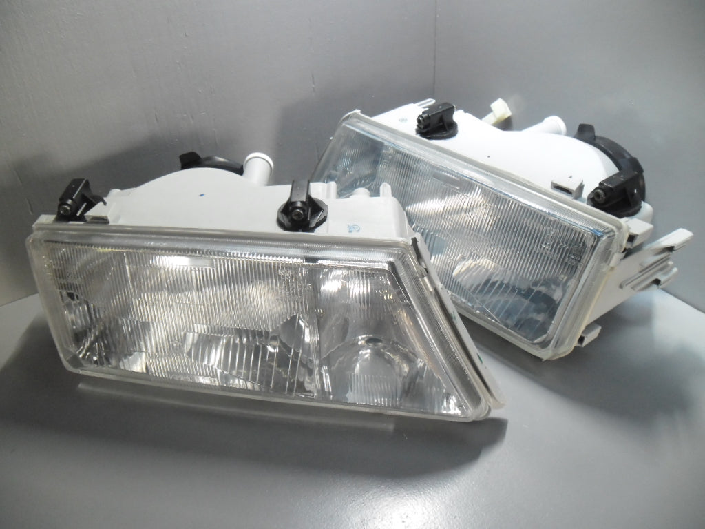 82457952 / 82457953 Lancia Dedra koplamp set met hoogte verstelling