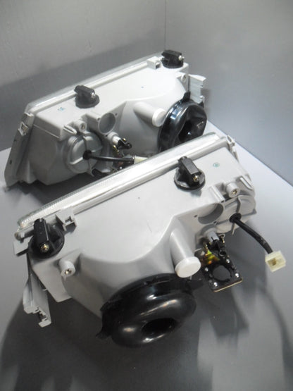 82457952 / 82457953 Lancia Dedra koplamp set met hoogte verstelling